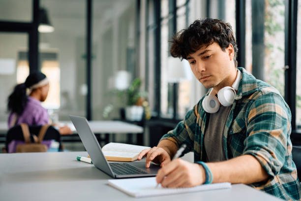 A student studying online at a laptop